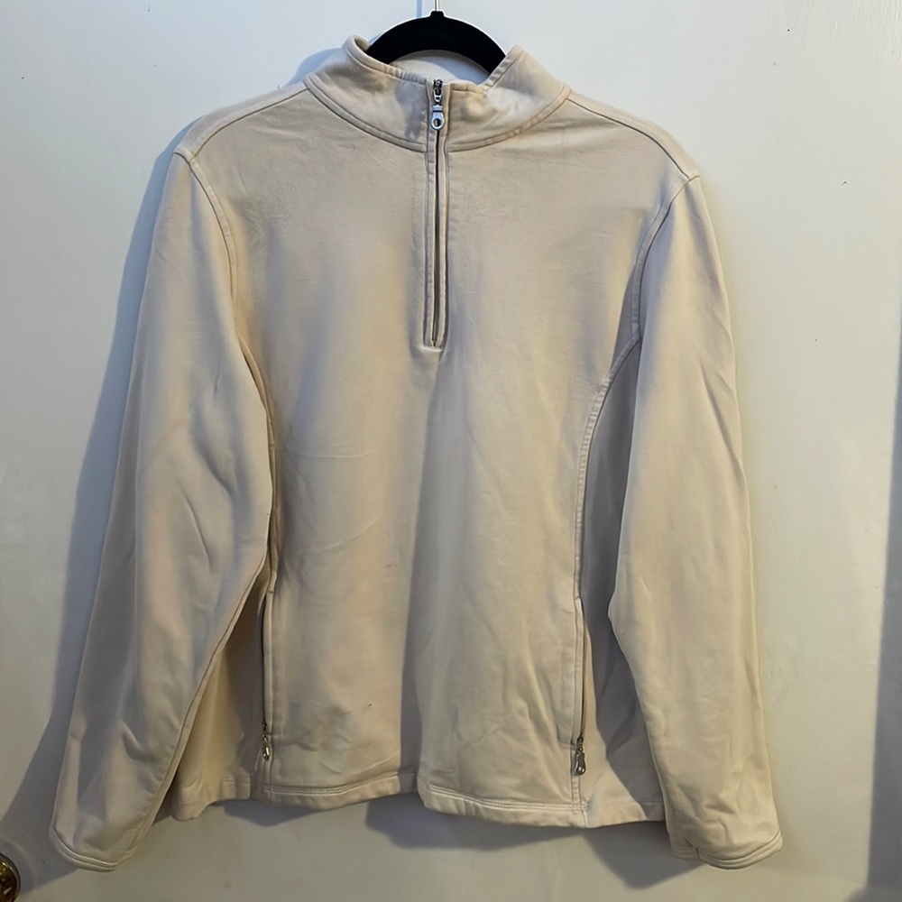 Turtleneck pullover with half zipper.